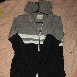 white gray & black windbreaker